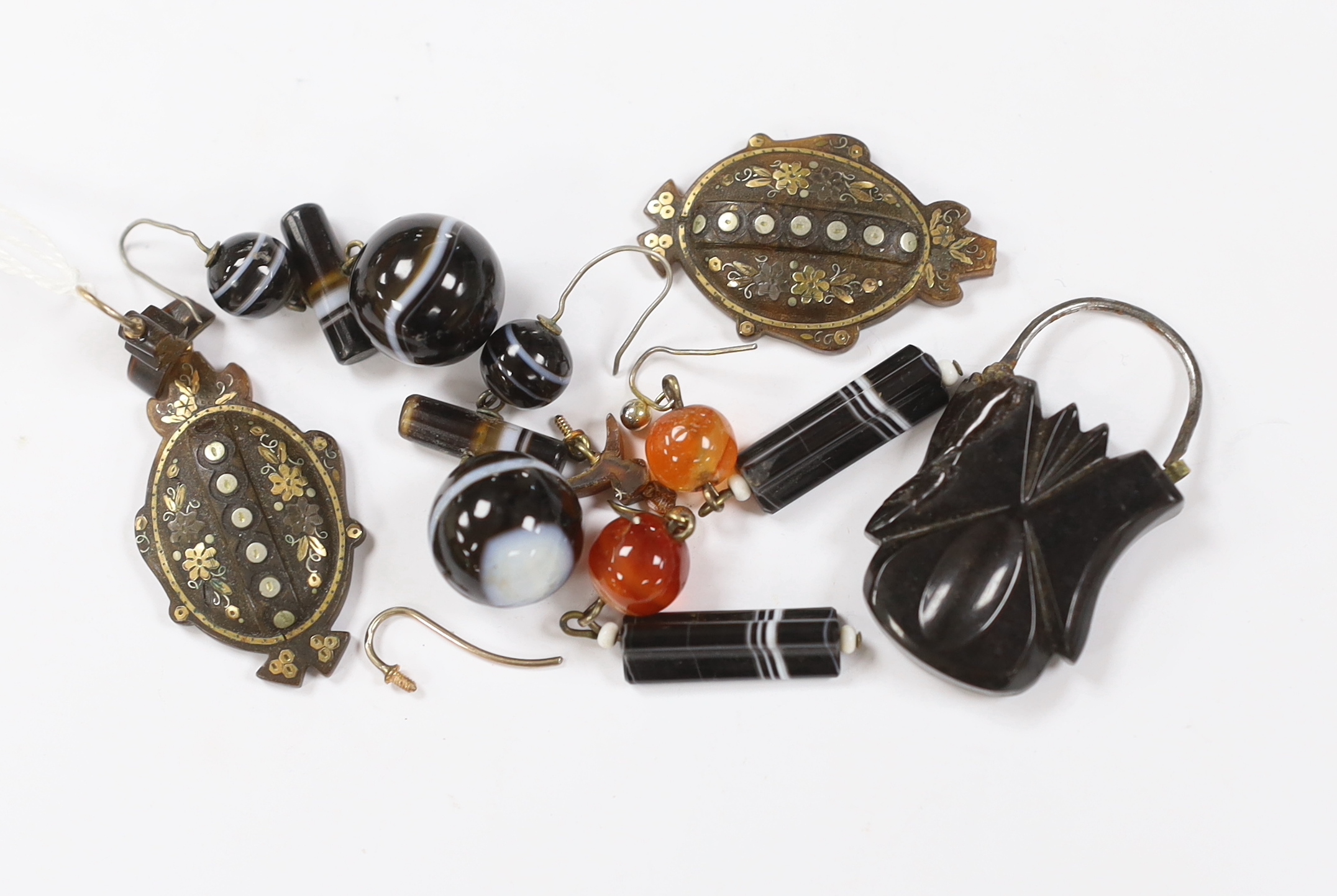 A pair of Victorian tortoiseshell pique drop earrings (a.f.), overall 52mm, two pairs of banded agate earrings and a jet padlock.